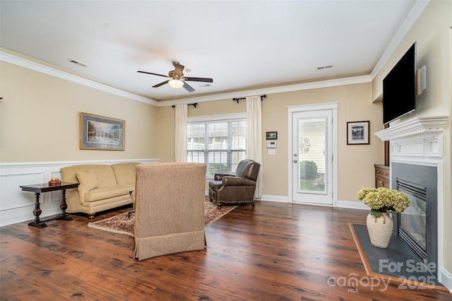 13714 Morehouse St, Huntersville, NC 28078 - living area with a glass covered fireplace, ceiling fan, crown molding, and wood finished floors