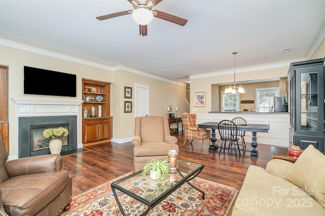 13714 Morehouse St, Huntersville, NC 28078 - living area featuring a chandelier, ornamental molding, a fireplace with flush hearth, dark wood finished floors, and ceiling fan