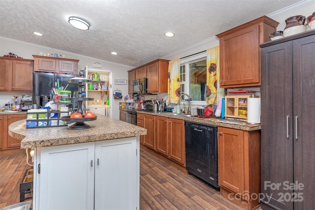 824 Brevard Place Rd, Iron Station, NC 28080 - kitchen featuring black appliances, washer and clothes dryer, ornamental molding, dark wood-style flooring, and a kitchen island