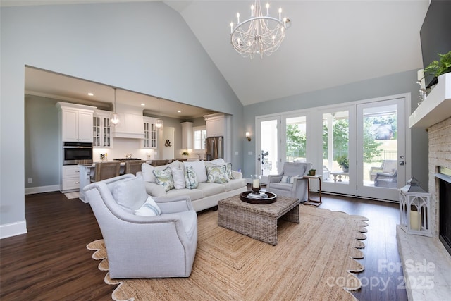 416 Yorkfield Dr, Shelby, NC 28150 - living area with high vaulted ceiling, a chandelier, dark wood-type flooring, and a fireplace