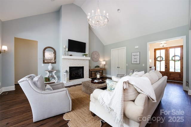416 Yorkfield Dr, Shelby, NC 28150 - living area featuring high vaulted ceiling, a chandelier, dark wood-style flooring, a fireplace, and french doors