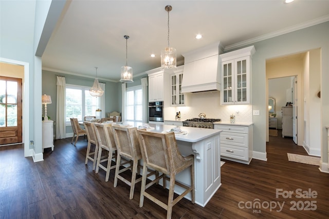 416 Yorkfield Dr, Shelby, NC 28150 - kitchen with crown molding, light countertops, white cabinetry, appliances with stainless steel finishes, and tasteful backsplash