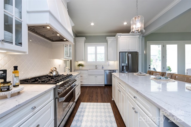 416 Yorkfield Dr, Shelby, NC 28150 - kitchen with stainless steel appliances, premium range hood, crown molding, white cabinetry, and backsplash