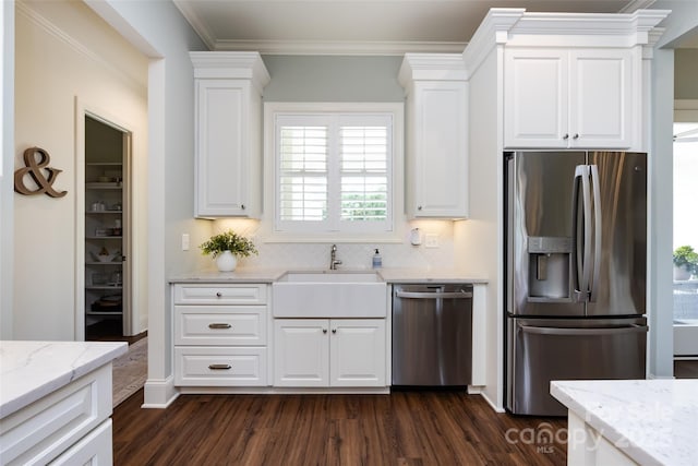 416 Yorkfield Dr, Shelby, NC 28150 - kitchen featuring appliances with stainless steel finishes, dark wood-style flooring, white cabinets, backsplash, and ornamental molding