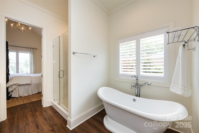 416 Yorkfield Dr, Shelby, NC 28150 - ensuite bathroom featuring a soaking tub, a stall shower, wood finished floors, and ornamental molding