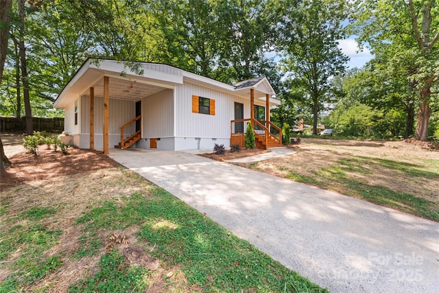 1050 Barnett Dr, Kings Mountain, NC 28086 - modern farmhouse style home with driveway, an attached carport, and crawl space