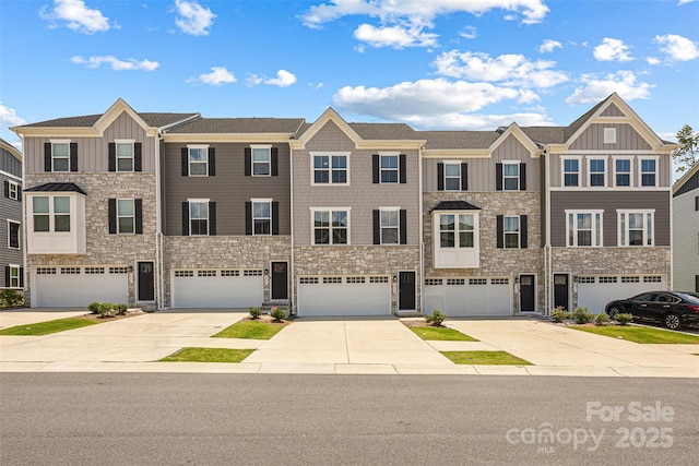 2040 Dornoch Rd, Tega Cay, SC 29708 - multi unit property with board and batten siding, stone siding, driveway, and an attached garage