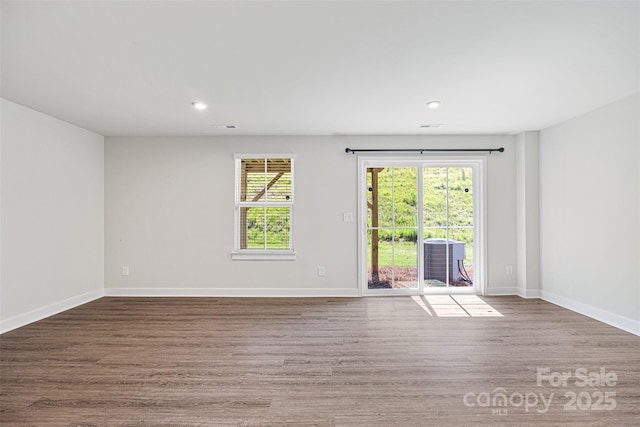 2040 Dornoch Rd, Tega Cay, SC 29708 - spare room with wood finished floors and recessed lighting
