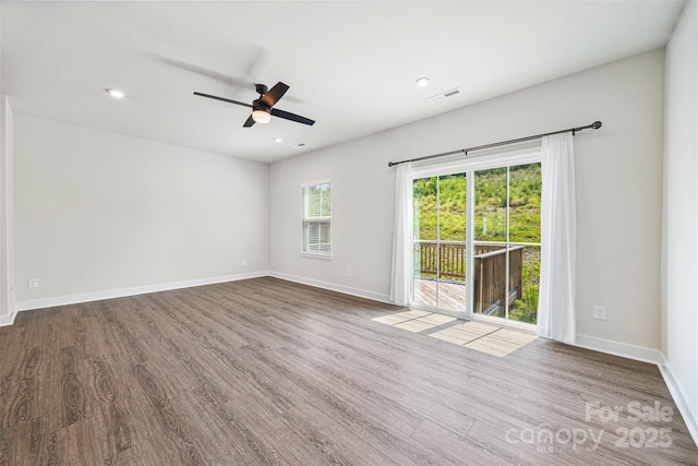 2040 Dornoch Rd, Tega Cay, SC 29708 - spare room featuring a ceiling fan, wood finished floors, and recessed lighting
