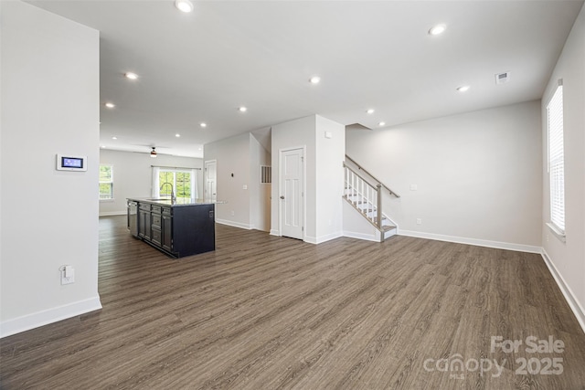 2040 Dornoch Rd, Tega Cay, SC 29708 - spare room featuring dark wood-style flooring, stairway, recessed lighting, and ceiling fan