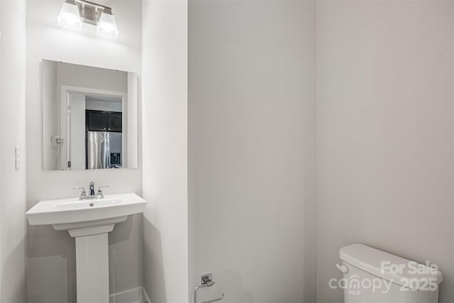 2040 Dornoch Rd, Tega Cay, SC 29708 - half bathroom with toilet and baseboards
