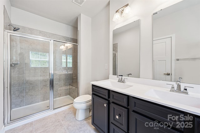 2040 Dornoch Rd, Tega Cay, SC 29708 - bathroom featuring double vanity, a shower stall, and tile patterned flooring