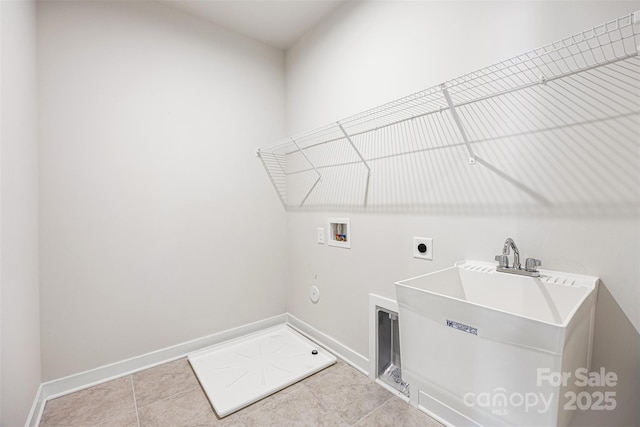 2040 Dornoch Rd, Tega Cay, SC 29708 - washroom with hookup for a washing machine, hookup for an electric dryer, light tile patterned flooring, and gas dryer hookup