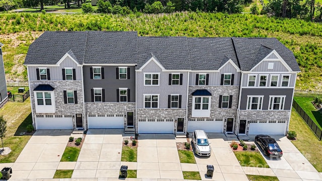 2040 Dornoch Rd, Tega Cay, SC 29708 - view of front of home featuring stone siding, board and batten siding, and concrete driveway