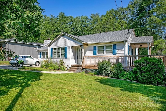 169 Montview Cir, Brevard, NC 28712 - view of front of home with a front lawn, a shingled roof, and a chimney