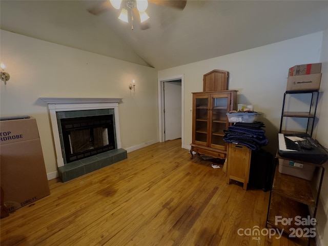 169 Montview Cir, Brevard, NC 28712 - living area featuring a ceiling fan, vaulted ceiling, wood finished floors, and a fireplace