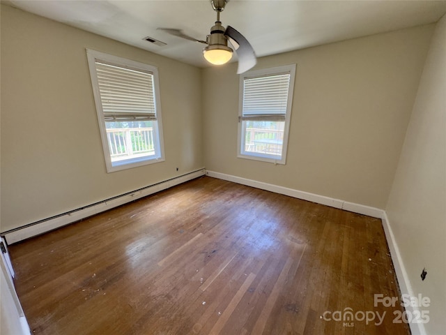 169 Montview Cir, Brevard, NC 28712 - spare room featuring a baseboard radiator, plenty of natural light, hardwood / wood-style flooring, and ceiling fan