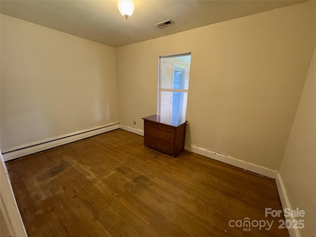 169 Montview Cir, Brevard, NC 28712 - unfurnished room featuring baseboard heating and dark wood-type flooring