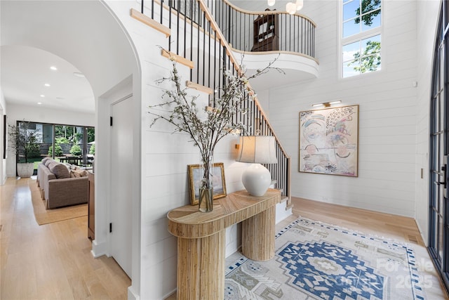 1401 Heather Ln, Charlotte, NC 28209 - foyer with wood finished floors, stairs, arched walkways, recessed lighting, and a towering ceiling