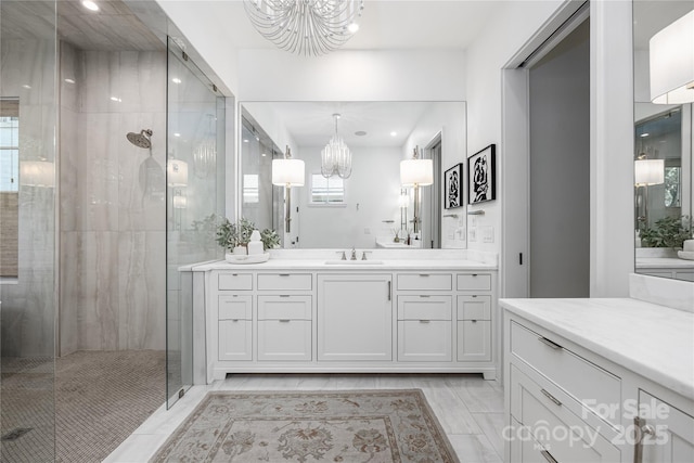 1401 Heather Ln, Charlotte, NC 28209 - full bathroom featuring a chandelier, a tile shower, vanity, marble finish floors, and recessed lighting
