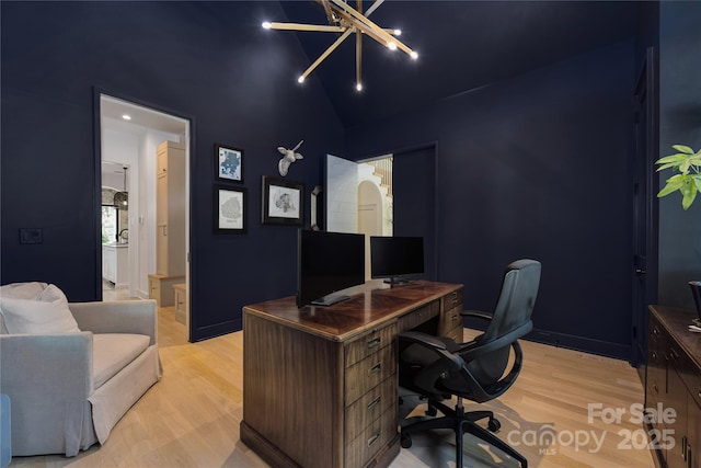 1401 Heather Ln, Charlotte, NC 28209 - office area featuring light wood-style flooring, high vaulted ceiling, and a chandelier