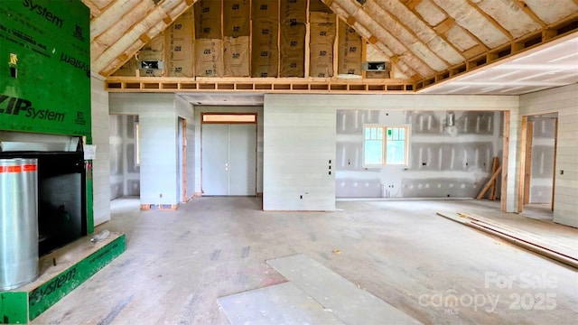 305 Sapphire Ridge Rd Unit B2, Sapphire, NC 28774 - miscellaneous room featuring high vaulted ceiling and unfinished concrete flooring