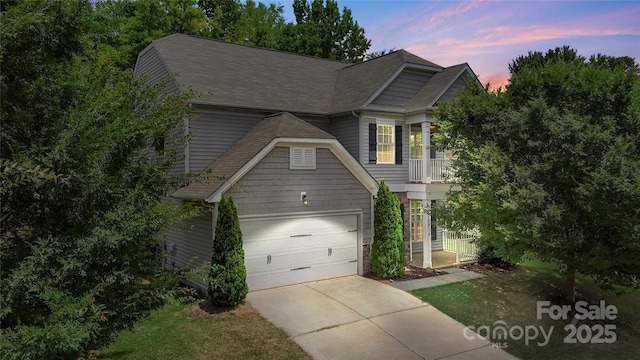 10806 Cove Point Dr, Charlotte, NC 28278 - traditional-style home with driveway, a shingled roof, and a garage