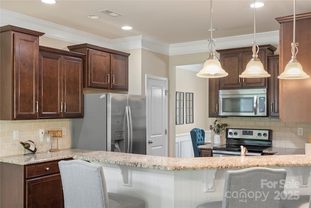 10806 Cove Point Dr, Charlotte, NC 28278 - kitchen featuring appliances with stainless steel finishes, light stone counters, ornamental molding, backsplash, and pendant lighting