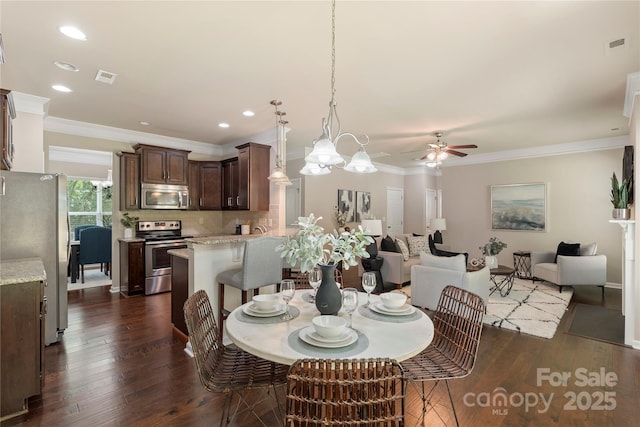 10806 Cove Point Dr, Charlotte, NC 28278 - dining area with a ceiling fan, dark wood-type flooring, crown molding, and recessed lighting