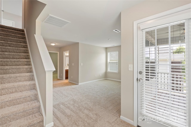 10806 Cove Point Dr, Charlotte, NC 28278 - entryway with light carpet and stairs