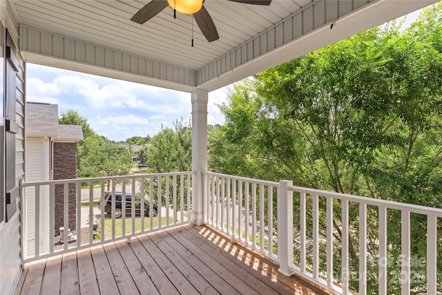 10806 Cove Point Dr, Charlotte, NC 28278 - wooden terrace featuring ceiling fan and view of wooded area
