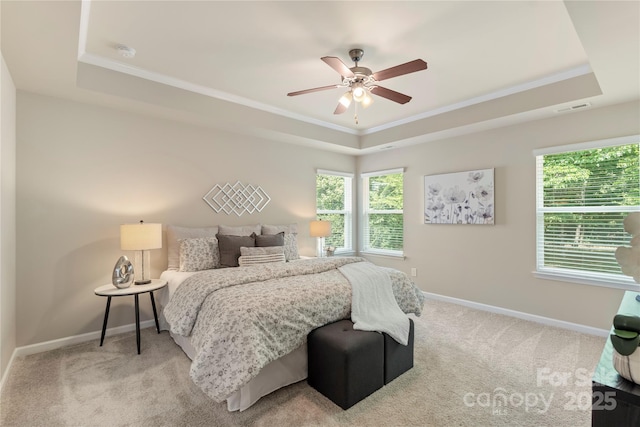 10806 Cove Point Dr, Charlotte, NC 28278 - carpeted bedroom featuring a raised ceiling, ornamental molding, and a ceiling fan