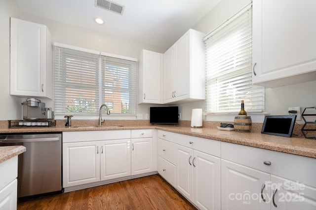 4937 S Hill View Dr, Charlotte, NC 28210 - kitchen featuring dishwasher, white cabinets, light wood-style floors, and recessed lighting