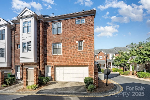 4937 S Hill View Dr, Charlotte, NC 28210 - multi unit property featuring brick siding, driveway, an attached garage, and a residential view