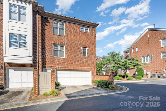 4937 S Hill View Dr, Charlotte, NC 28210 - view of home's exterior with a garage and brick siding