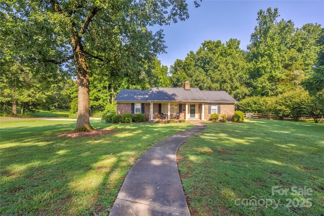 1828 Independence Sq, Kannapolis, NC 28081 - ranch-style house featuring a chimney, covered porch, and brick siding