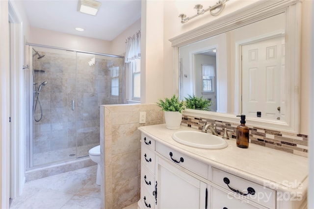 1828 Independence Sq, Kannapolis, NC 28081 - bathroom featuring vanity, a stall shower, and decorative backsplash