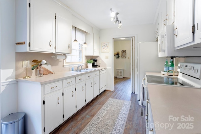 1828 Independence Sq, Kannapolis, NC 28081 - kitchen with white appliances, white cabinetry, light countertops, and dark wood finished floors
