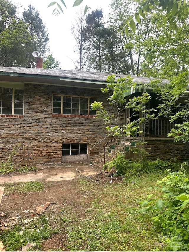 2870 Rutherford College Rd, Connelly Springs, NC 28612 - view of property exterior with a chimney, stone siding, and stairs