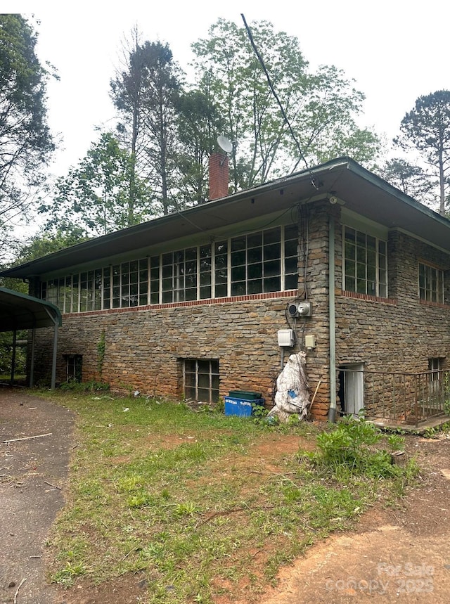 2870 Rutherford College Rd, Connelly Springs, NC 28612 - view of home's exterior featuring stone siding, a chimney, and driveway