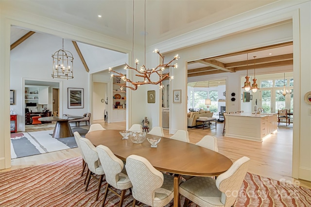 2632 Bartram Pl, Winston Salem, NC 27106 - dining area with a chandelier, beam ceiling, and light wood-type flooring