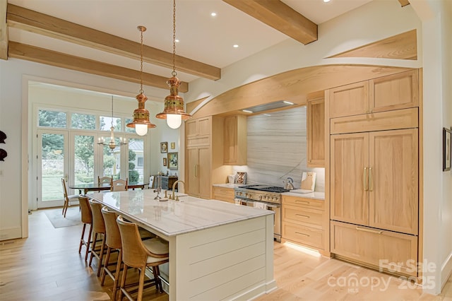 2632 Bartram Pl, Winston Salem, NC 27106 - kitchen with premium appliances, light brown cabinetry, beam ceiling, light wood-type flooring, and a chandelier