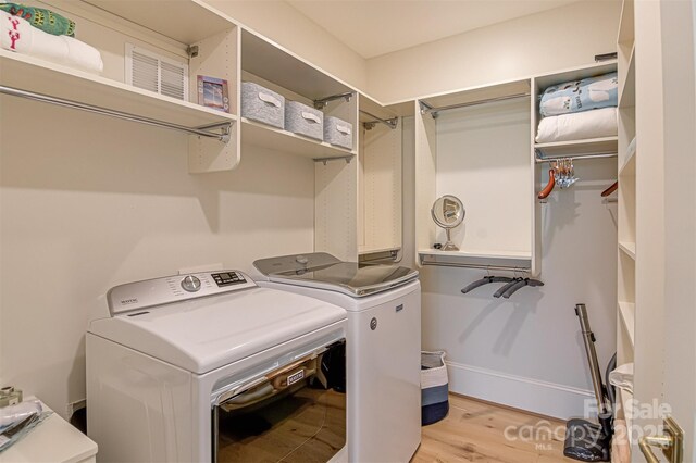 2632 Bartram Pl, Winston Salem, NC 27106 - laundry room with light wood-type flooring and separate washer and dryer