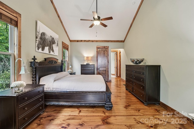 71 Raptor Way, Sapphire, NC 28774 - bedroom featuring vaulted ceiling, crown molding, wood finished floors, and a ceiling fan