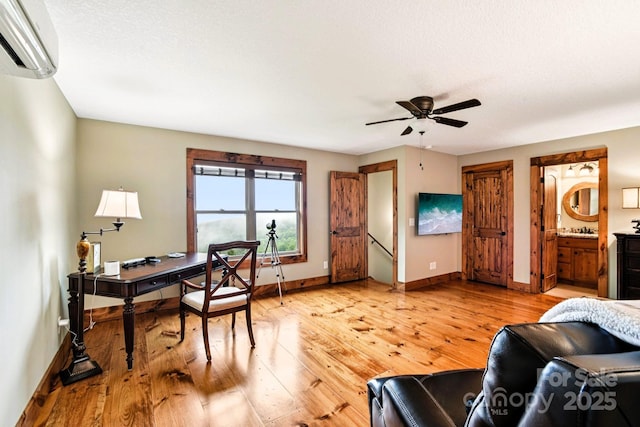 71 Raptor Way, Sapphire, NC 28774 - office with a wall unit AC, light wood finished floors, and a ceiling fan