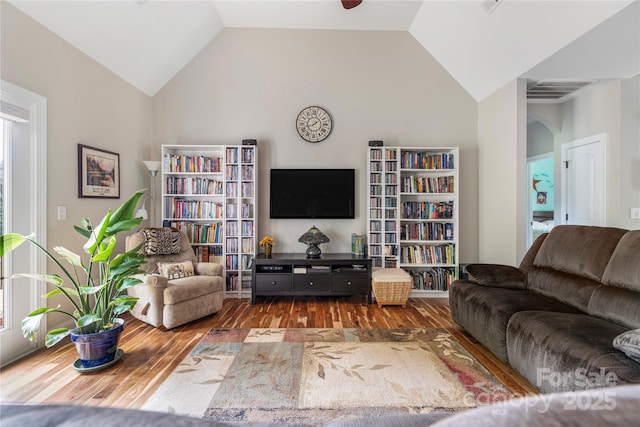 233 Highland Forest Dr, Clover, SC 29710 - living area featuring arched walkways, wood finished floors, and high vaulted ceiling