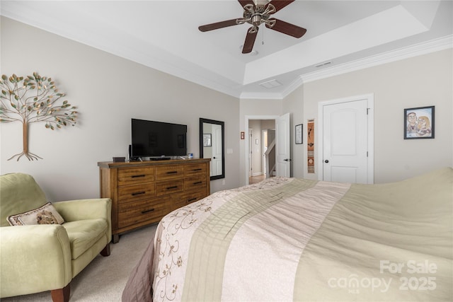 233 Highland Forest Dr, Clover, SC 29710 - bedroom featuring a tray ceiling, light colored carpet, crown molding, and a ceiling fan