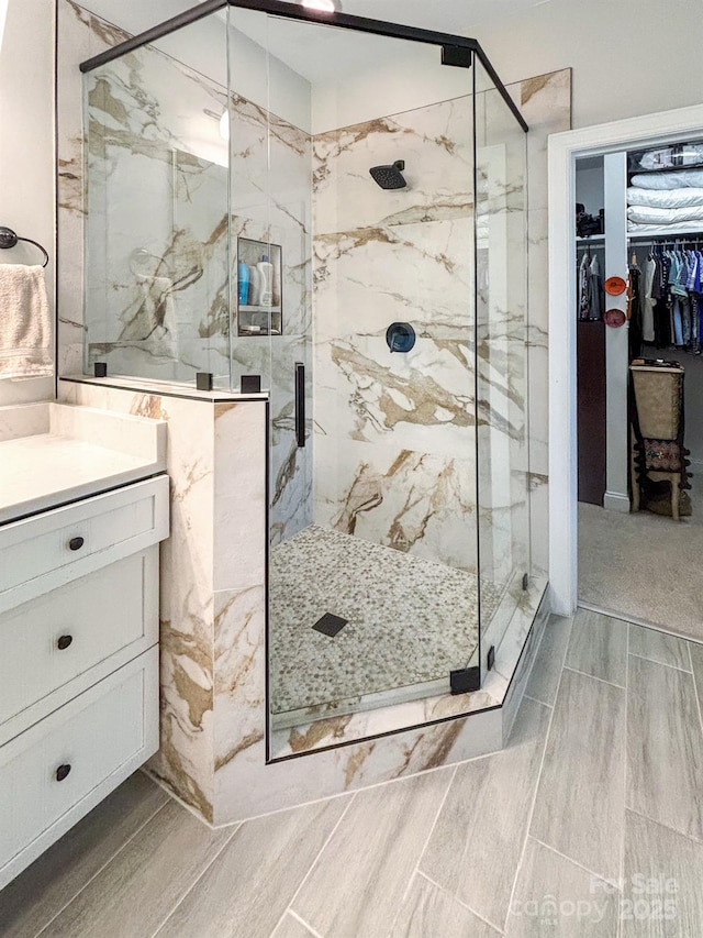 233 Highland Forest Dr, Clover, SC 29710 - bathroom with a marble finish shower, vanity, and a walk in closet