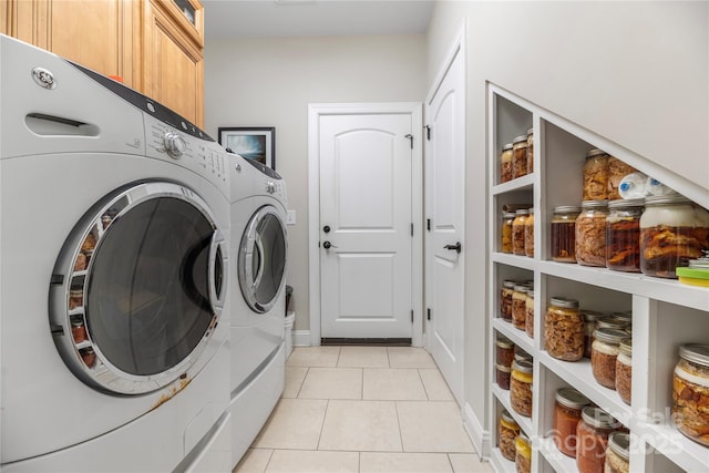 233 Highland Forest Dr, Clover, SC 29710 - laundry room with cabinet space, washer and clothes dryer, and light tile patterned floors