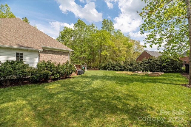 233 Highland Forest Dr, Clover, SC 29710 - view of grassy yard with a vegetable garden